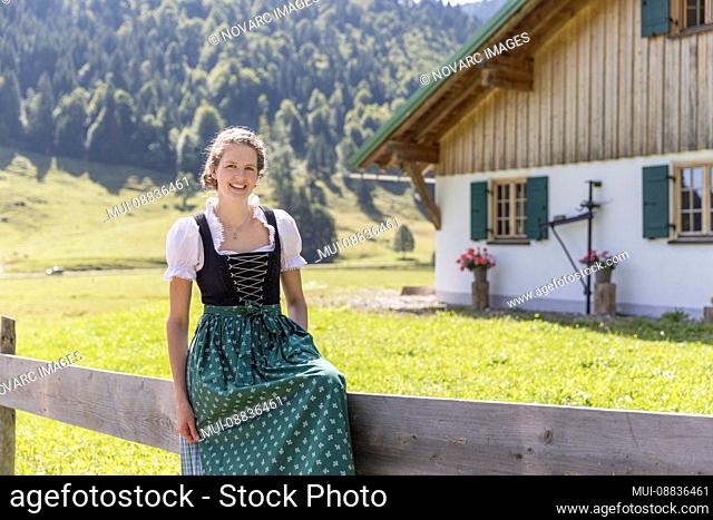 Portrait of a young farmer's wife with dirndl