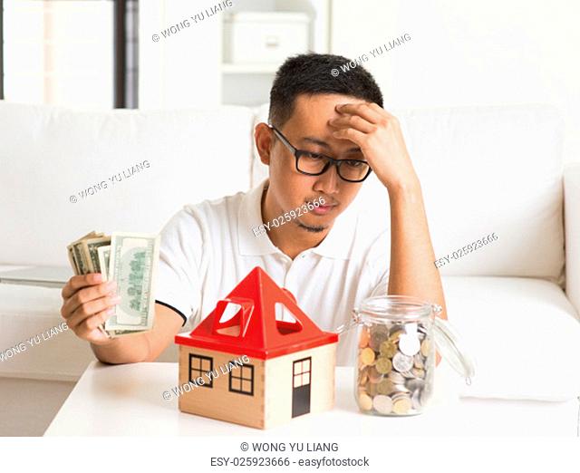 asian man having trouble with debts