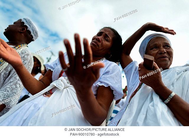 A Cadomblefollower becomes possessed during the festival of Yemanya, the goddess of the sea, in Salvador, Bahia, Brazil, 2 February 2012