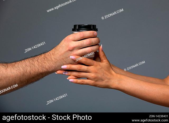 Cups With A Coffee In The Hands Of Men And Women. Selective Focus
