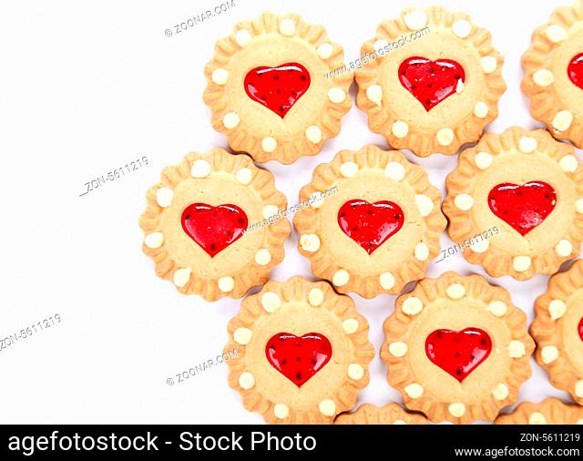 Heart shaped strawberry biscuit on a white background