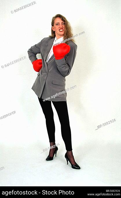 Blonde woman with boxing gloves, Berlin, Germany, Europe