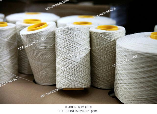 White spools of sewing thread