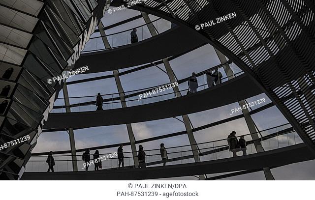 Visitors to the Reichstag dome can be seen as silhouettes in Berlin, Germany 26 January 2017. Around 8, 000 people want to visit the dome over the Bundestag...