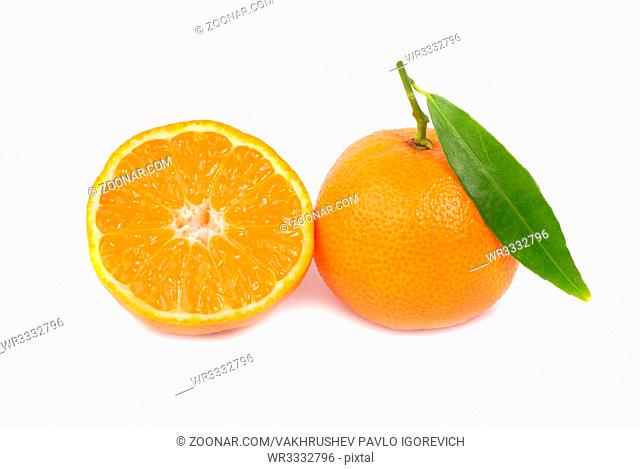 Two orange mandarins with green leaf isolated on white background