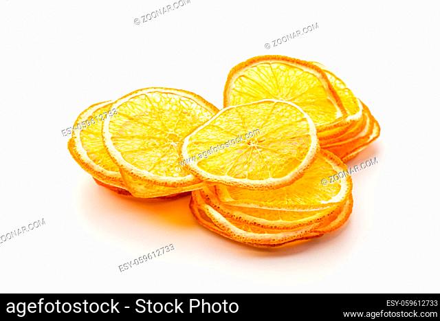 Orange dried fruits heap close up isolated on white