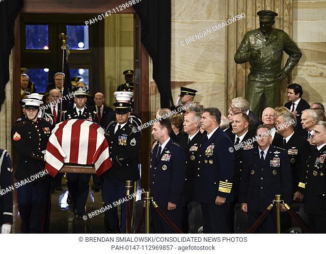 The casket bearing the remains of former US President George H.W. Bush arrives at the US Capitol during the State Funeral in Washington, DC, December 3, 2018