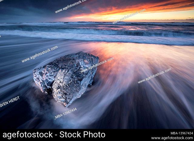 Chunks of ice on the coast of Iceland near the glacier lagoon at sunrise