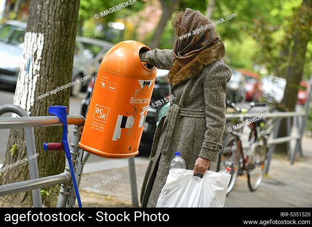 Posed symbol photo, old-age poverty, senior citizen, collecting bottles
