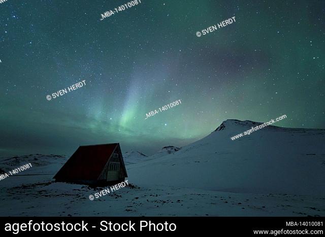 northern lights over a refuge on the snaefellsnes peninsula