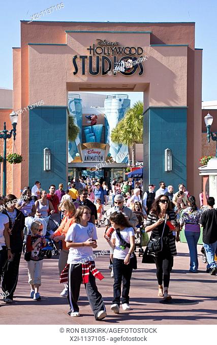 Orlando, FL - Feb 2009 - Park visitors walk under Disney's Hollywood Studios sign above walkway at Hollywood Studios theme park in Kissimmee Orlando Florida