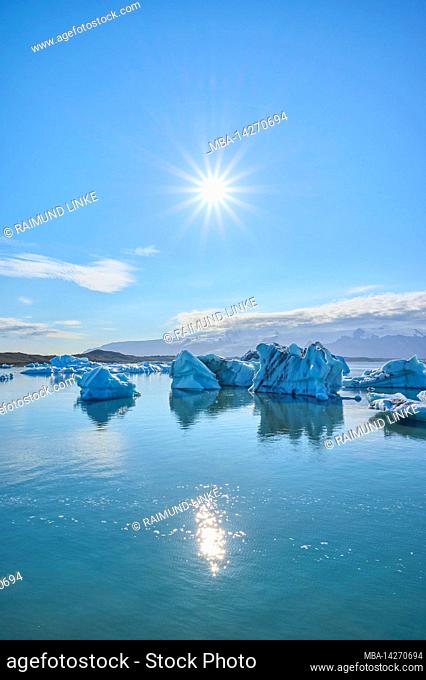 Glacier lagoon, ice, floes, fog, clouds, sun, summer, Jokulsarlon, Austurland, Iceland