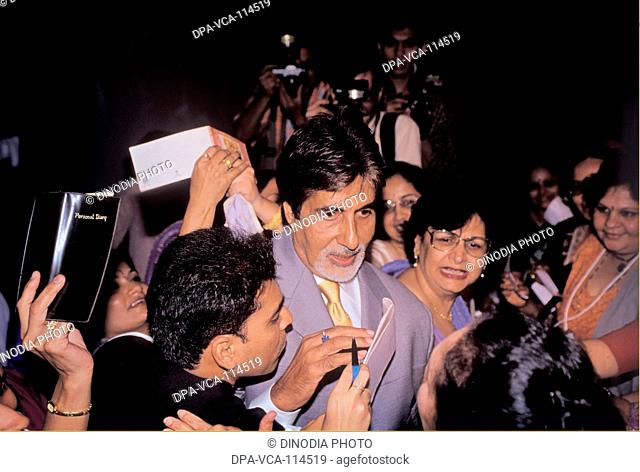 South Asian Indian Bollywood actor Amitabh Bachchan surrounded by his fans at a function at Oberoi hotels ; Bombay Mumbai  ; Maharashtra ; India NO MR