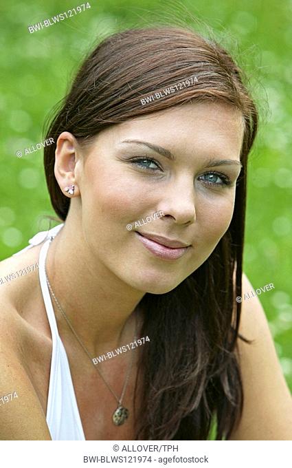 young darkhaired woman outdoors, portrait