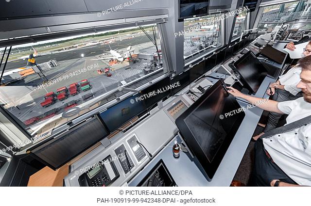 19 September 2019, Hamburg: Apron controllers work in a research and test tower at Hamburg Airport. The German Aerospace Center (DLR) is testing solutions to...