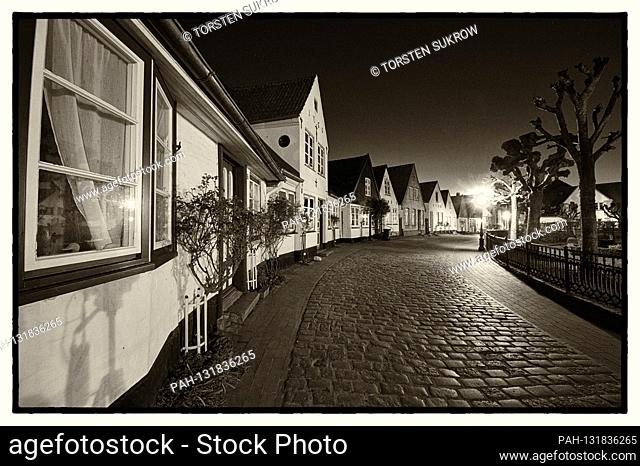 April 17th, 2020, Schleswig, the fishing settlement Holm in the Schleswig old town. B / W photo on a beautiful spring evening at dusk