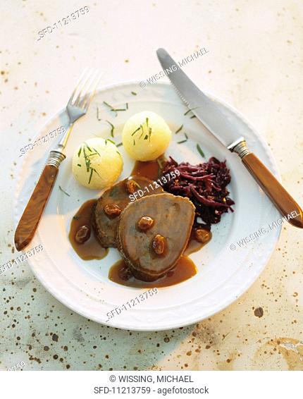 Roast beef with dumplings and red cabbage