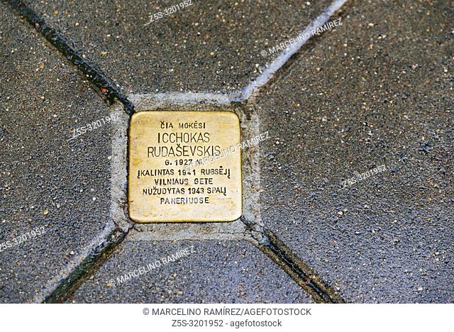 Copper-plated memorial plaque, embedded in the pavement of the old Town of Vilnius to commemorate the memory of residents of the city who fell victim to the...