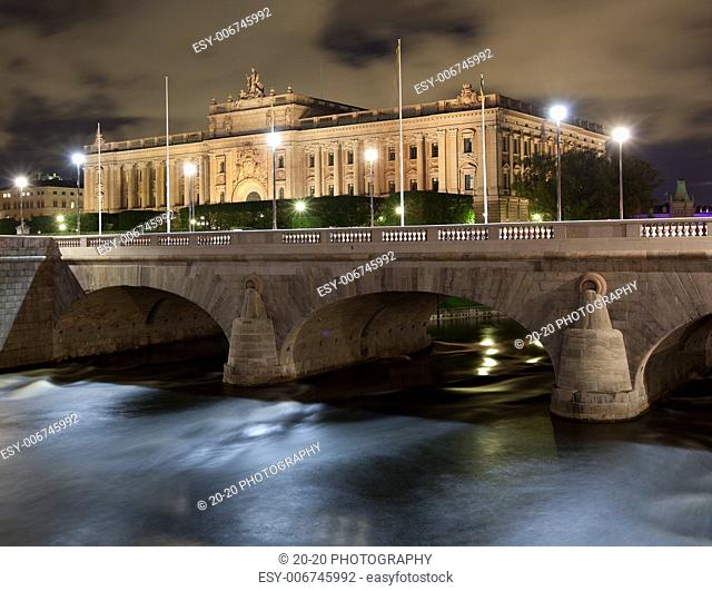 Stockholm, Night time, water flowing under bridges leading to the Old Town