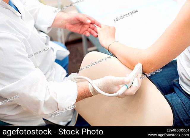 Adult female patient elbow joint ultrasound at private clinic. ultrasound of woman's elbow joint - diagnosis