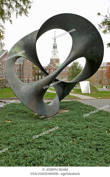A metal sculpture stands in front of the Baker Tower on the campus of Dartmouth College in Hanover, New Hampshire