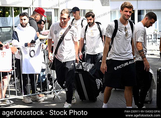 11 September 2023, North Rhine-Westphalia, Dortmund: The players of the national team go to the hotel with their luggage