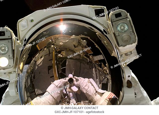 Astronaut Heidemarie M. Stefanyshyn-Piper, STS-115 mission specialist, exposed this self-portrait during the Sept. 12 space walk that marked the resumption of...