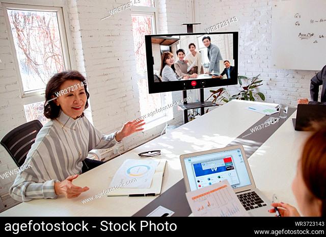 Business team in the conference room open video conference