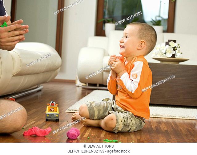 Boy playing on the floor