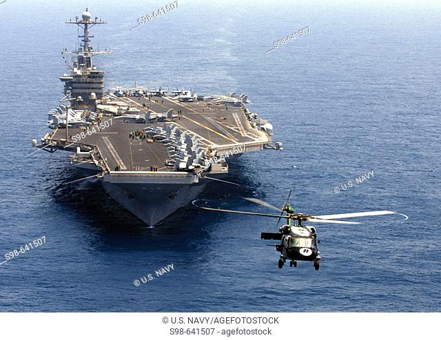 ARABIAN SEA (April 13, 2007) - An SH-60F Seahawk, from the 'Eightballers' of Helicopter Anti-Submarine Squadron (HS) 8, hovers in the air as Nimitz-class...