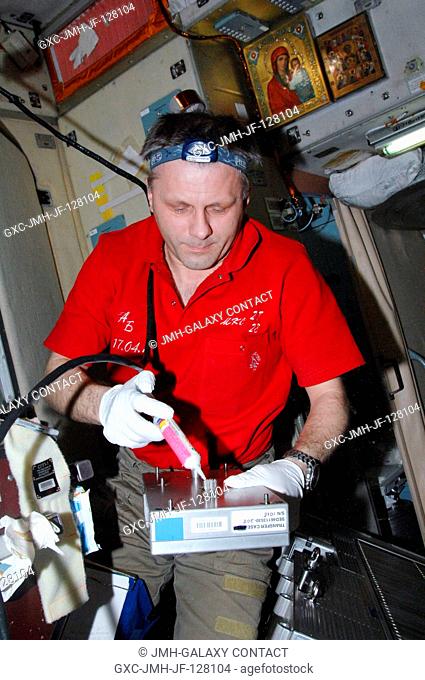 Russian cosmonaut Andrey Borisenko, Expedition 28 commander, performs in-flight maintenance on the Treadmill Vibration Isolation System (TVIS) in the Zvezda...