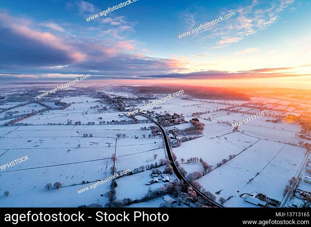 Sunrise in Wiesmoor, Eastfrisa on a cold winter morning with snow and a colorful sunrise