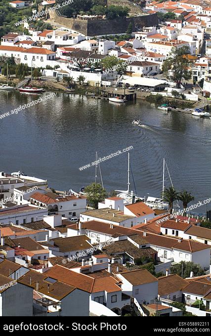 View of spanish Sanlucar and Portuguese Alcoutim towns divided by the Guadiana river