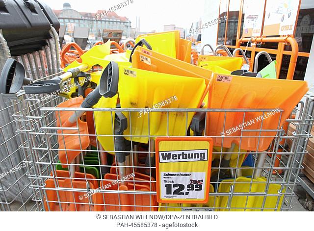Snow shovels are presented in front of a building supplies store in Leipzig, Germany, 17 January 2014. In the next few weeks a slight decline of temperatures is...
