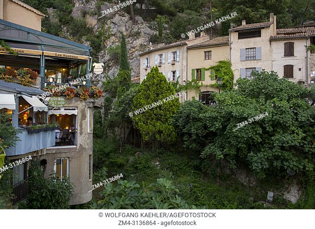 A village scene with houses in Moustiers-Sainte-Marie, a medieval village in Alpes-de-Haute-Provence region in southern France