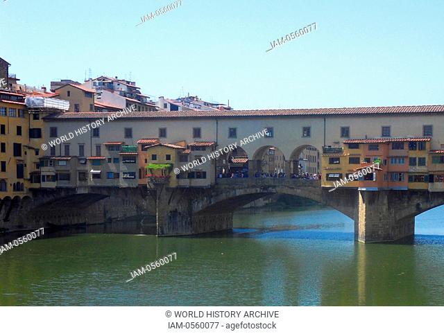 The Ponte Vecchio medieval stone closed-spandrel segmental arch bridge over the Arno River, in Florence, Italy, noted for still having shops built along it