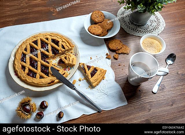 the table set for breakfast on a wooden table in autumn