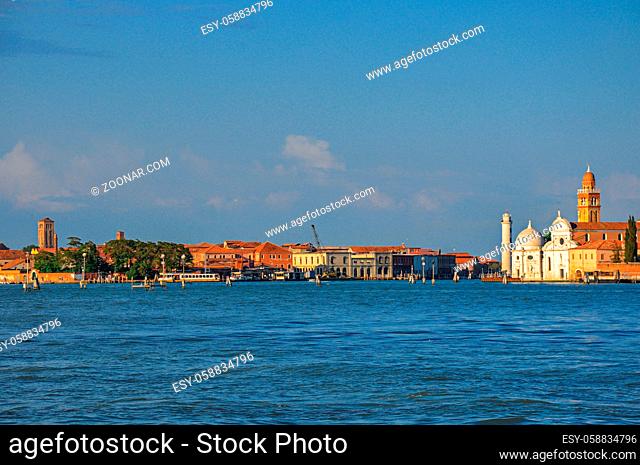 Panoramic view of Venice lagoon with buildings on the horizon, at the sunset in the city center of Venice, the historic and amazing marine city