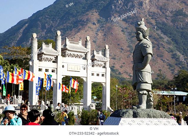 Statue and gateway on the approach to Po Lin Monastery, Lantau Island, Hong Kong