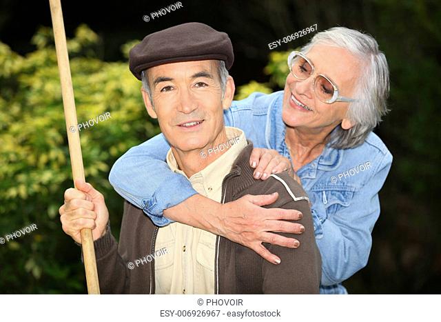 Senior couple playing outdoors