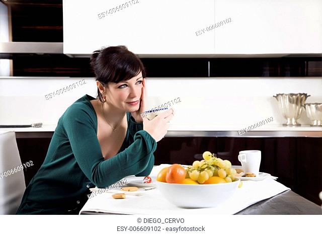home life: woman relaxing and drinking a cup of tea