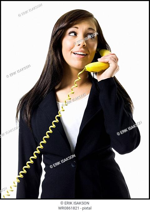 Portrait of a teenage girl talking on the telephone