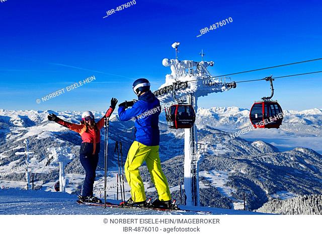 Young skiers pose at the Hohe Salve for a photo, Hopfgarten, Tyrol, Austria