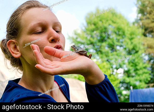 cinderella kissing little nice frog on palm