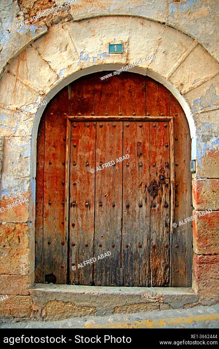 wooden door with stone archway, Valderrobres, Teruel, Spain
