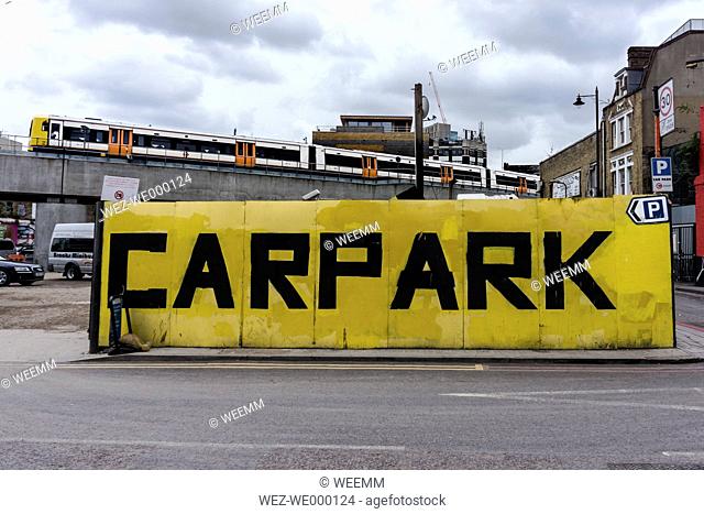 England, London, Shoreditch, Holywell Lane, carpark sign in front of elevated railway