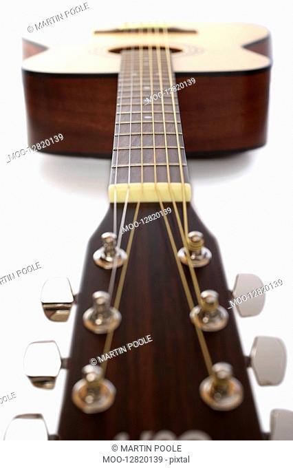 Acoustic guitar in studio surface view