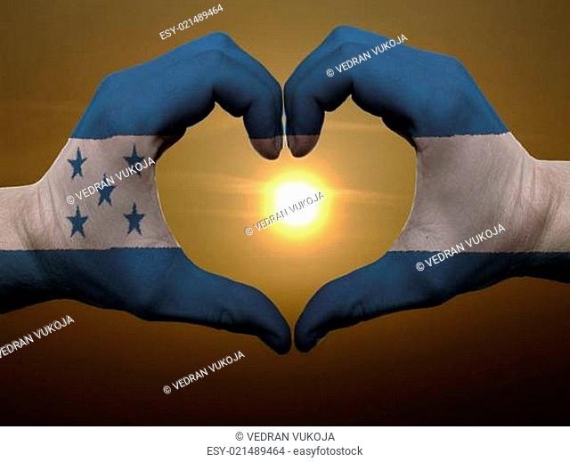 Heart and love gesture by hands colored in honduras flag during