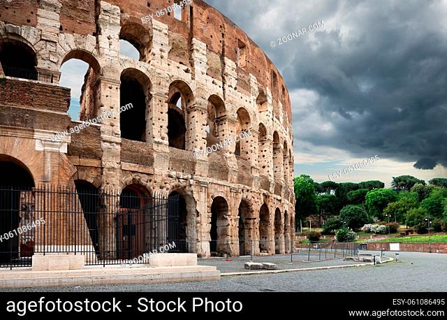 Gray thunder clouds over Colosseum in summer Rome