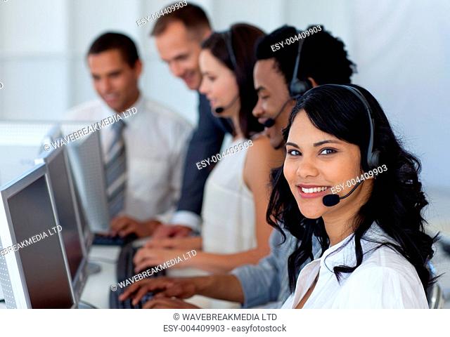Business team working in a call center with a ma ger